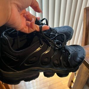 Gently used black Nike Air Max. Small wear and tear at the bottom. No box